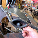 Metal horse sculpture eye construction in the workshop