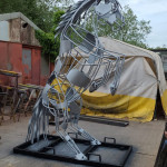 Horse sculpture with silver paint outside workshop