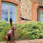 Sitting and leaping hare sculptures