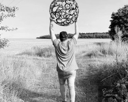 William Moulton-Day carrying 650mm sphere to field