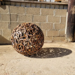 Rusty Creations misfit horseshoe sphere outside the workshop