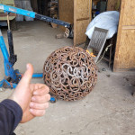 Misfit sphere getting a thumbs up outside Rusty Creations workshop